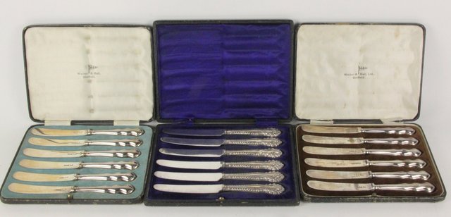 Two boxed sets of six silver