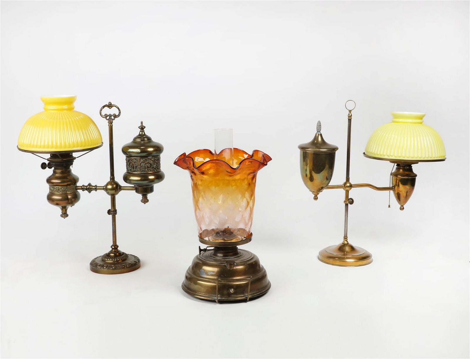 TWO BRASS AND GLASS ADJUSTABLE