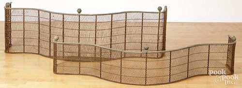 TWO BRASS AND WIRE FIRE FENDERS,