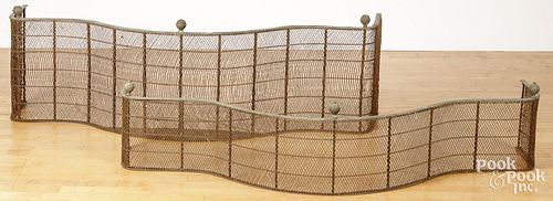 TWO BRASS AND WIRE FIRE FENDERS,