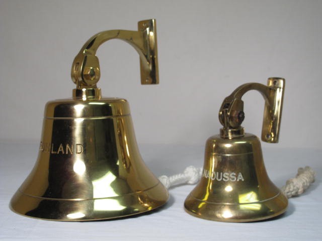 Two brass nautical ships bells.
