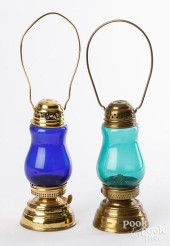 TWO BRASS SKATER&#039;S LAMPS,