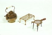 TWO BRASS TRIVETS AND A KETTLE