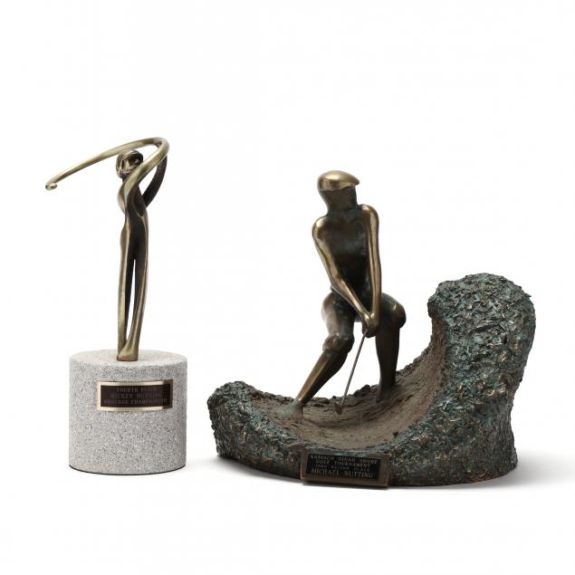 TWO BRONZE GOLF TROPHIES The larger