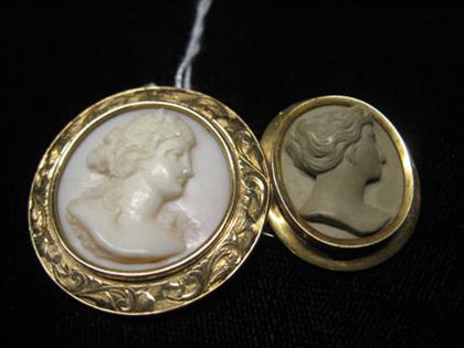 Two cameo pins one lava, one