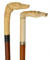 TWO CANES HAVING IVORY HEADS,