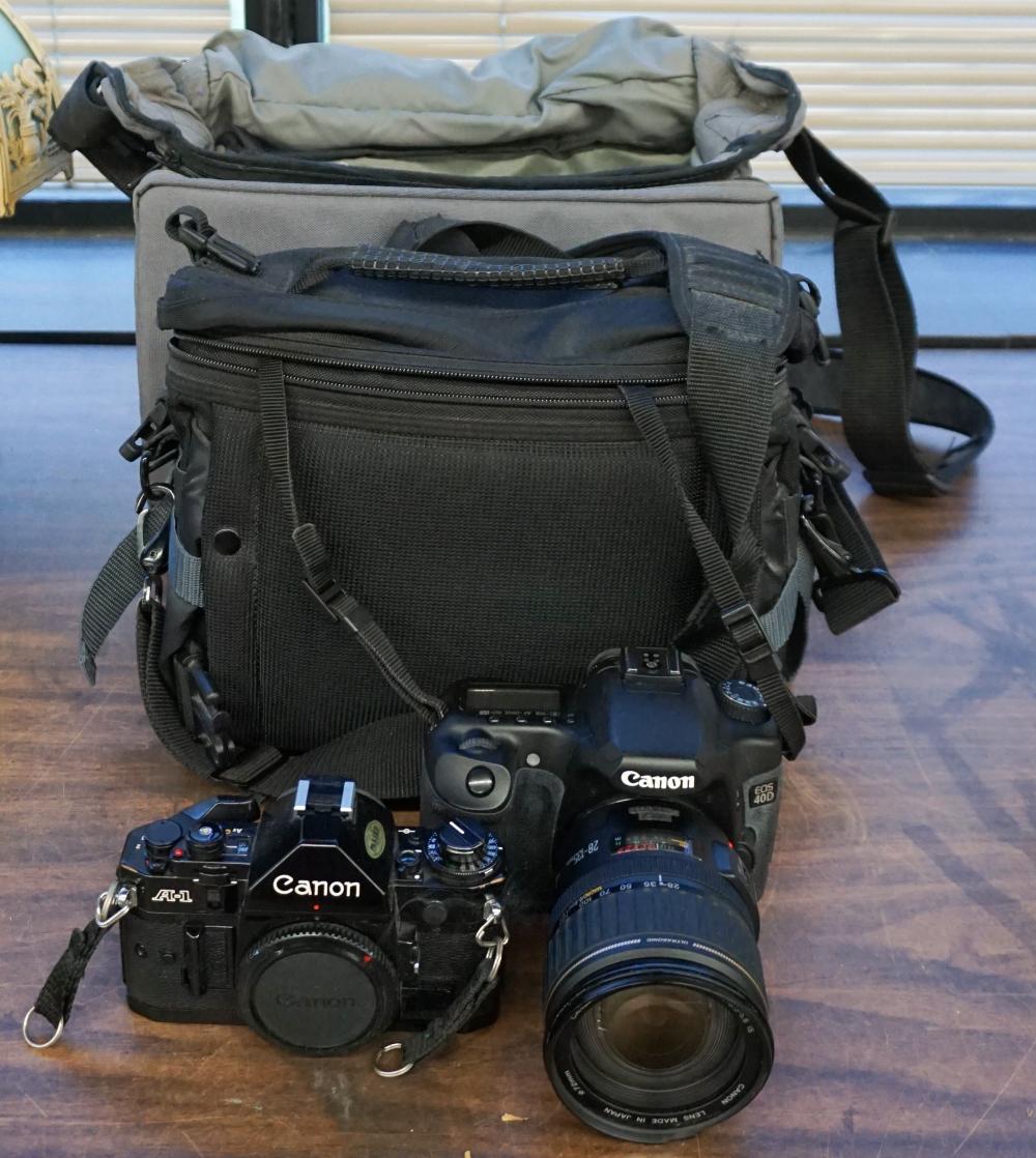 TWO CANON CAMERAS AND CAMERA