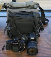 TWO CANON CAMERAS AND CAMERA A