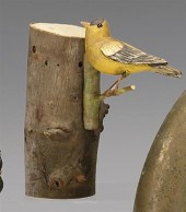 Two carved and painted birds