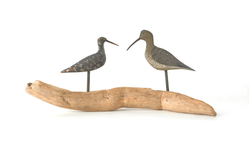 Two carved and painted shore bird