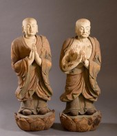 TWO CARVED AND PAINTED WOOD BU