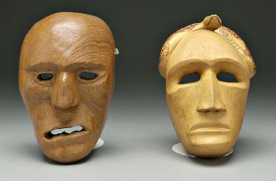 Two carved Cherokee masks: one with
