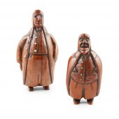 TWO CARVED COQUILLA NUT CHARAC