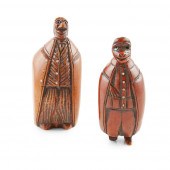 TWO CARVED COQUILLA NUT CHARAC