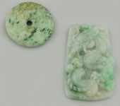TWO CARVED GREEN JADE PENDANTS