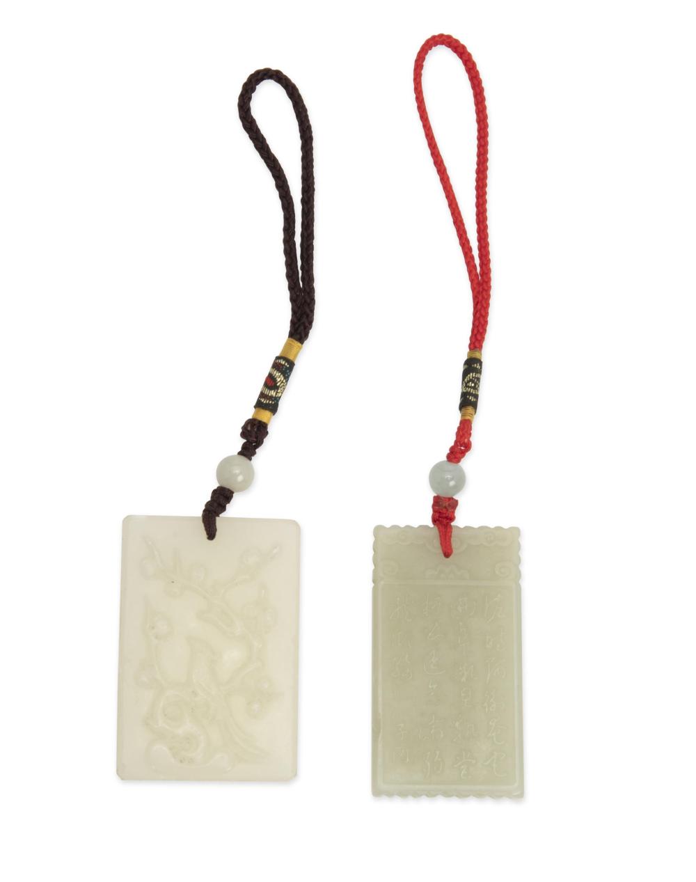 TWO CARVED JADE PENDANTSTwo