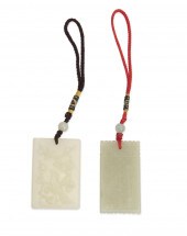 TWO CARVED JADE PENDANTSTwo ca