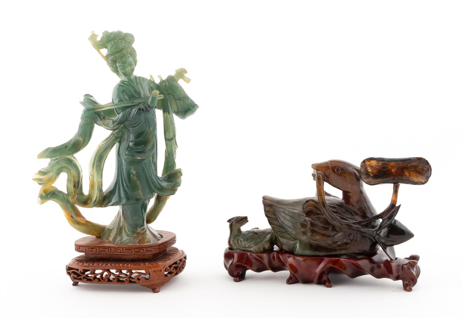 TWO CARVED JADE PIECES ON STANDS
