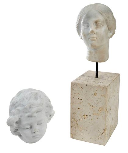 TWO CARVED MARBLE HEADSRoman or