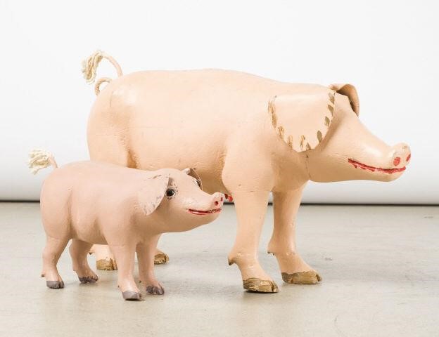 TWO CARVED PIGS BY AIMé DéSMEULES