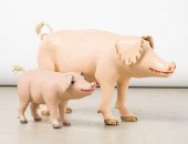 TWO CARVED PIGS BY AIMé DéSMEU