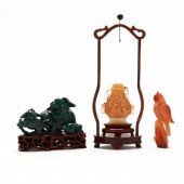 TWO CARVED STONE ANIMALS AND A