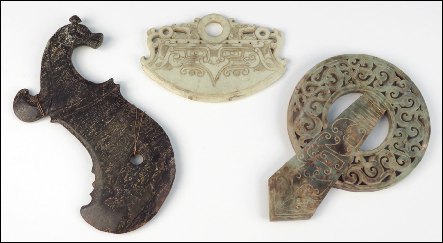 TWO CARVED STONE WEAPONS.