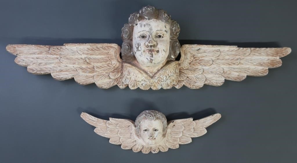 Two carved Victorian style winged