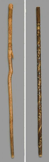 Two carved walking sticks    e