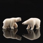 TWO CARVED WALRUS TUSK POLAR B