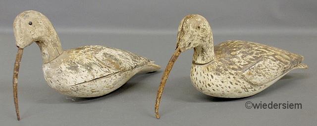 Two carved wood and paint decorated
