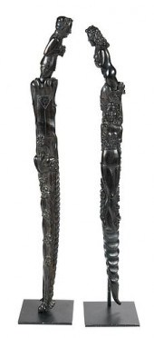 TWO CARVED WOOD FIGURAL SWORDS