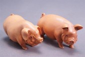 TWO CARVED WOOD FIGURES OF PIG