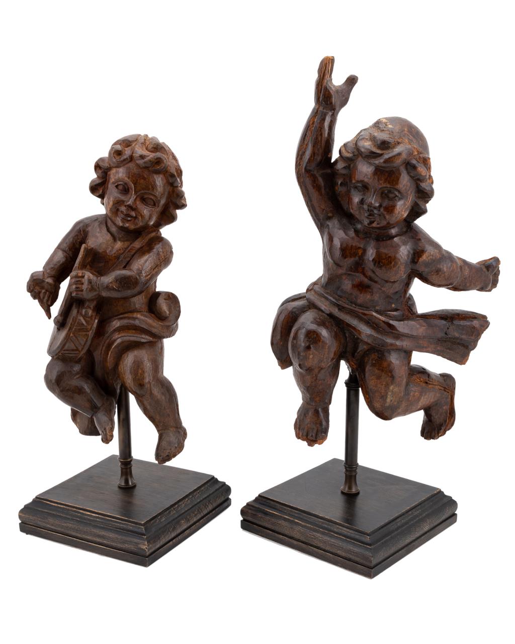 TWO CARVED WOODEN CHERUBS ON