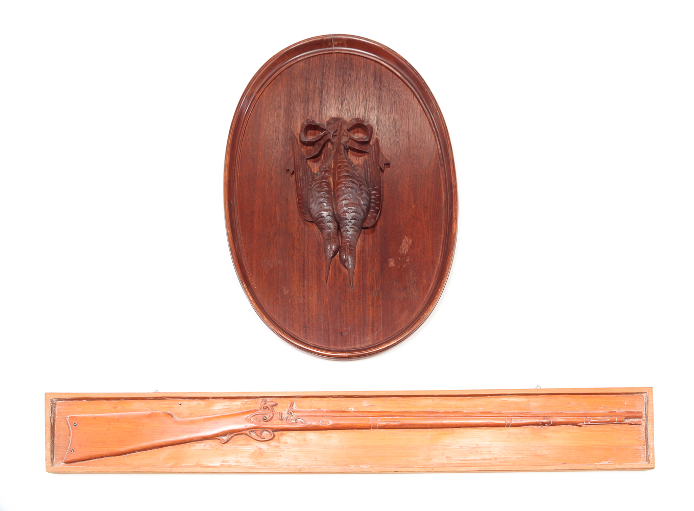TWO CARVED WOODEN PLAQUES.