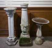 TWO CAST CEMENT PEDESTALS AND
