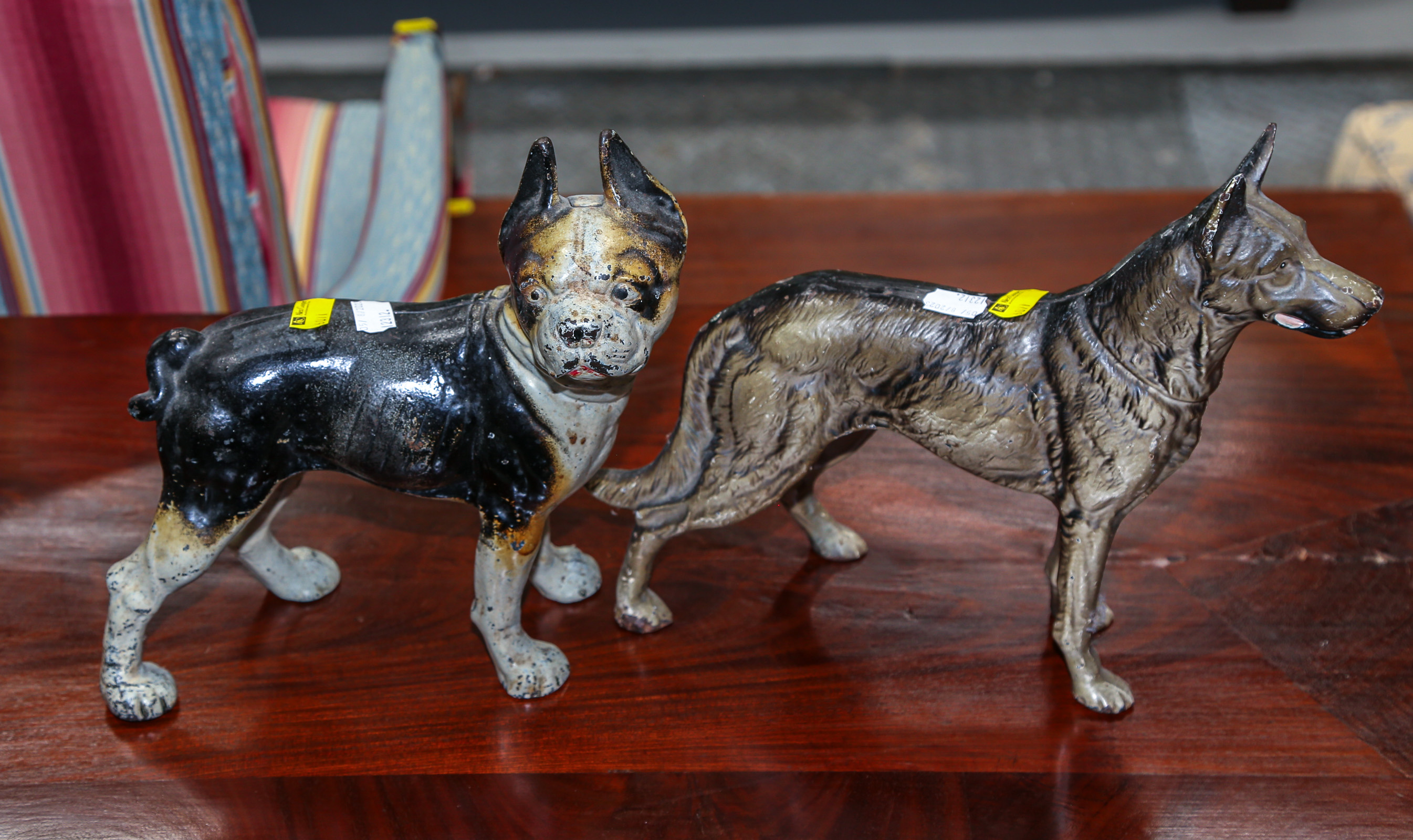 TWO CAST IRON DOG DOORSTOPS