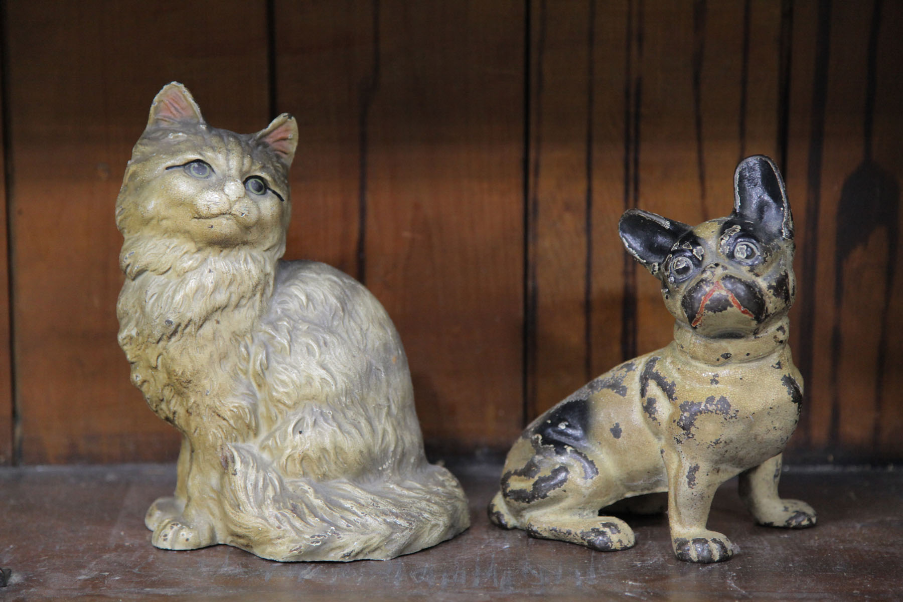 TWO CAST IRON DOORSTOPS.  American.
