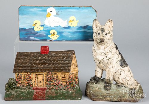 TWO CAST IRON DOORSTOPS, ETC.Two