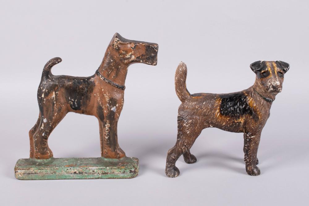 TWO CAST IRON DOORSTOPS IN THE FORM