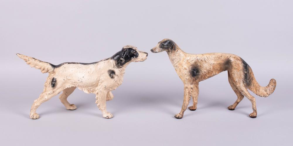 TWO CAST IRON DOORSTOPS IN THE FORM