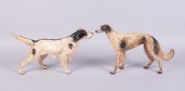 TWO CAST IRON DOORSTOPS IN THE