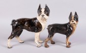 TWO CAST IRON DOORSTOPS IN THE