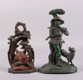 TWO CAST IRON DOORSTOPS IN THE