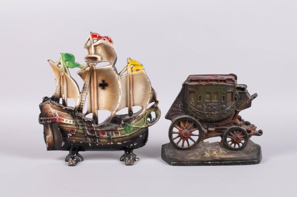 TWO CAST IRON DOORSTOPS IN THE FORM