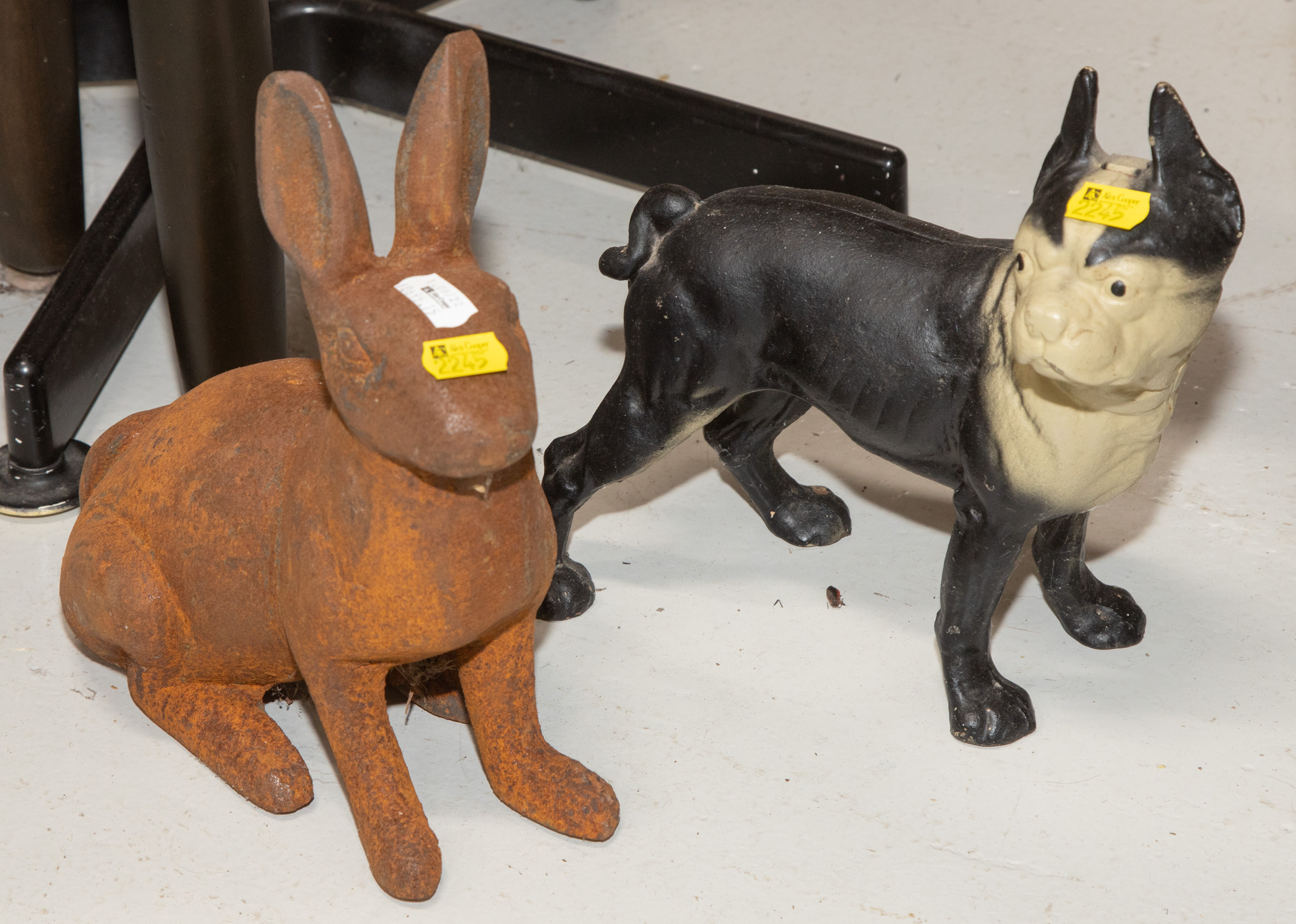 TWO CAST IRON DOORSTOPS Includes