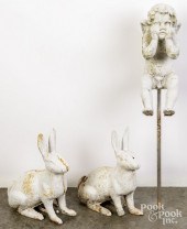 TWO CAST IRON GARDEN RABBITS,