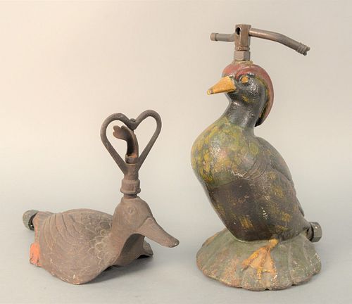 TWO CAST IRON LAWN SPRINKLERS, WOOD