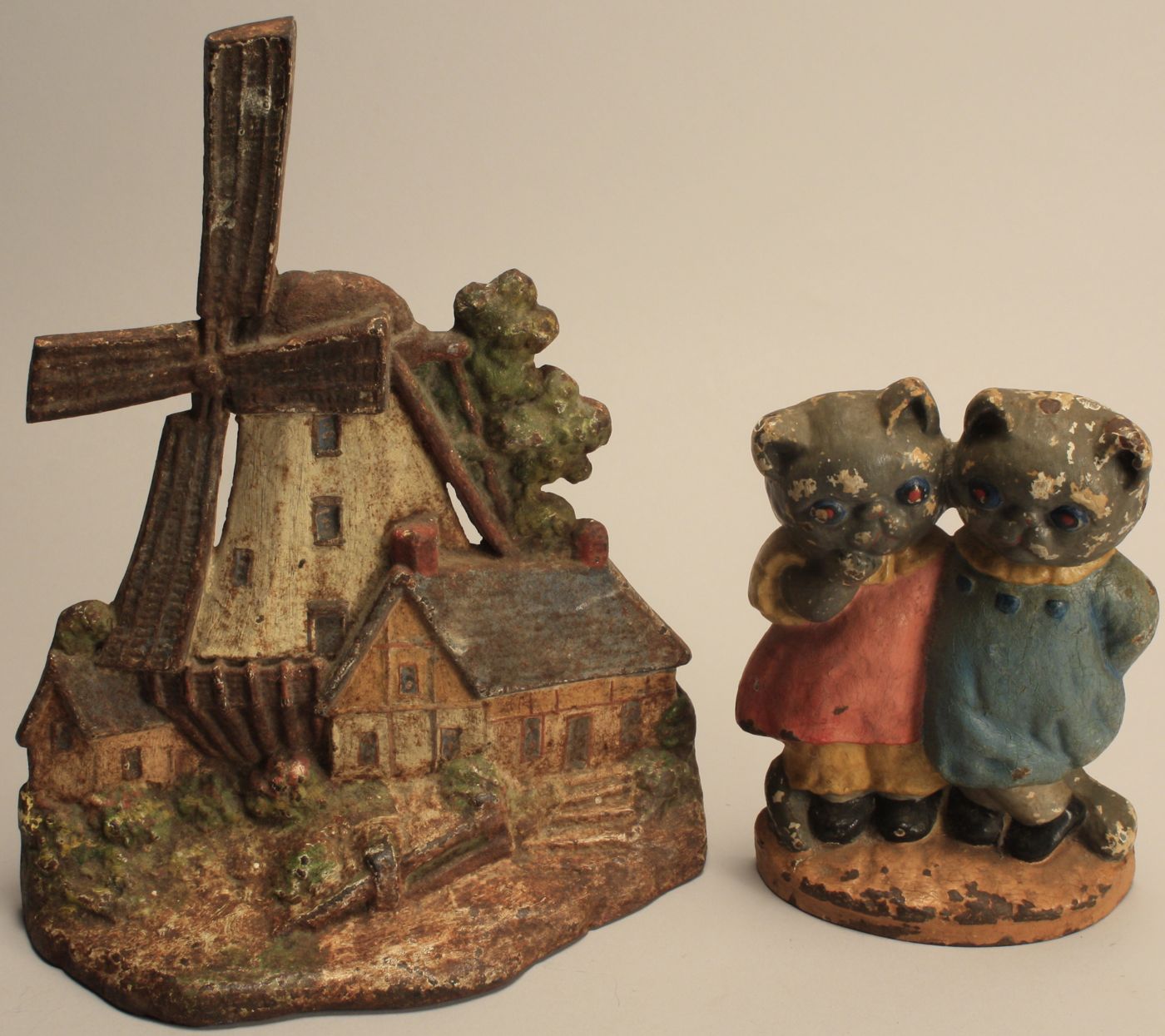 TWO CAST IRON PAINTED DOORSTOPS20th