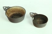 TWO CAST IRON PORRINGERS.  Ame